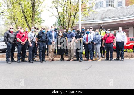 Hospital workers standing with Concord Police and Concord Fire outside of Emerson Hospital after the Appreciation Parade thanking healthcare workers. Stock Photo