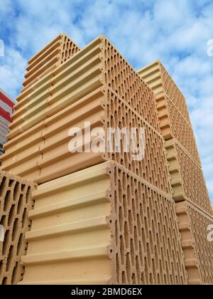 Ceramic construction blocks arranged in stack for house construction Stock Photo