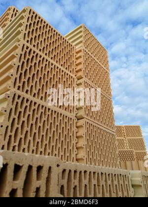 Ceramic construction blocks arranged in stack for house construction Stock Photo