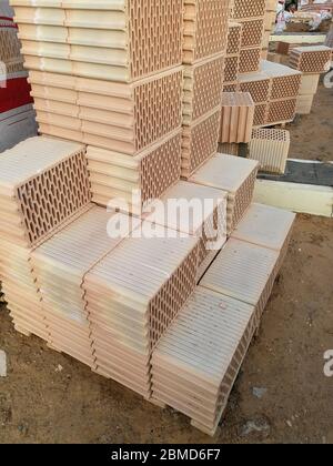 Ceramic construction blocks arranged in stack for house construction Stock Photo