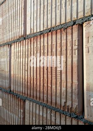 Abstract close up of wall built from ceramic construction block Stock Photo