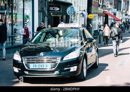 Amsterdam Netherlands April 22, 2019 View of a classic Dutch taxi in the streets of Amsterdam in the afternoon Stock Photo