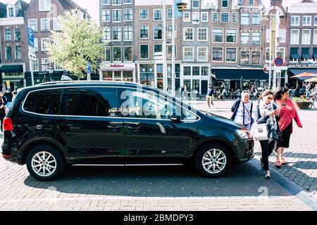 Amsterdam Netherlands April 22, 2019 View of a classic Dutch taxi in the streets of Amsterdam in the afternoon Stock Photo