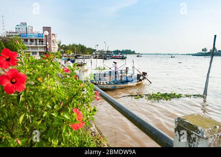 Can Tho Vietnam - October 16 2013; From side of Mekong River in city with boats and life along the river. Stock Photo