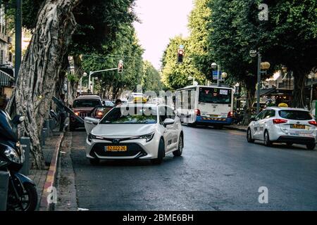 Tel Aviv Israel November 14, 2019 View of traditional Israeli taxi rolling in the streets of Tel Aviv in the afternoon Stock Photo