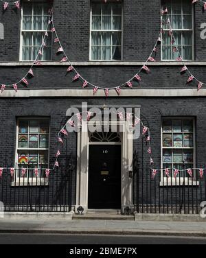 Day Forty Six of Lockdown, in London, which coincides with the 75th Anniversary celebrations of VE Day. Bunting on Number 10 Downing Street. Due to the country being on lockdown, many celebrations will have to take place in peoples homes and front gardens, whilst keeping socially distant from others. Large celebrations were to take place and The Mall was expected to be packed with people and the Royal family, including Queen Elizabeth II, would normally have been on the balcony of Buckingham ready to watch a flypast from the Red Arrows. The country is on lockdown due to the COVID-19 Coronaviru Stock Photo