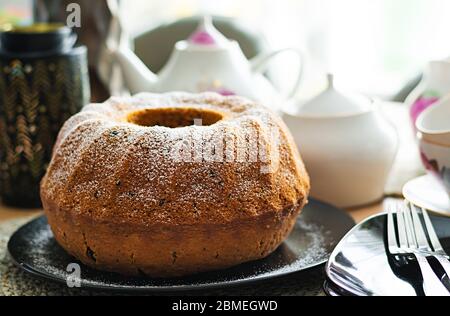 Pumpkin cake with chocolate chips for autumn fall dinner. Vegetarian food. Stock Photo