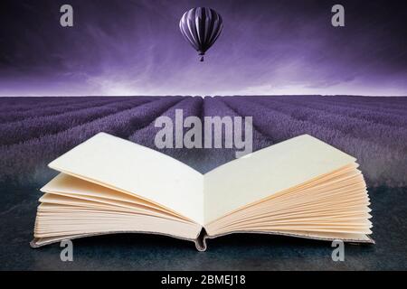 Conceptual composite open book image of Lavender field Summer sunset landscape with hot air balloon toned in monochrome Stock Photo