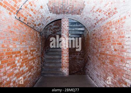 A spiral staircase from the red bricks Stock Photo