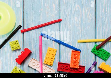 Multicolored plastic building blocks of the designer. Background of bright plastic building blocks Stock Photo