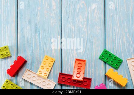 Multicolored plastic building blocks of the designer. Background of bright plastic building blocks Stock Photo