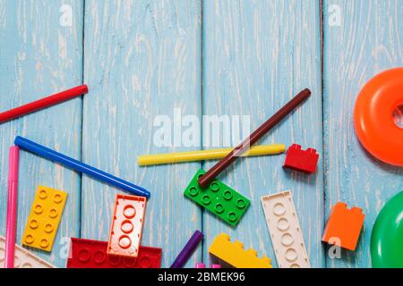 Multicolored plastic building blocks of the designer. Background of bright plastic building blocks Stock Photo