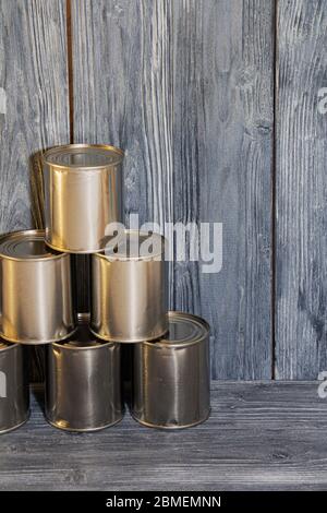 A number of closed metal sealed food cans, food supply, crisis. Stock Photo