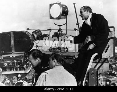 errol flynn, milton krims, on the set of the movie crossed swords, 1953  Stock Photo - Alamy