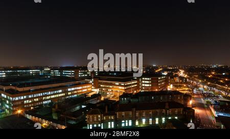 London, England, UK - February 19, 2013: St George's Hospital and St George's University of London medical school buildings are lit at night in Tootin Stock Photo