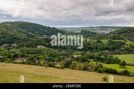 Houses of Matlock Bath and Cromford dot the wooded valley of Matlock Dale in the Derbyshire Peak District, with Matlock Town in the distance. Stock Photo