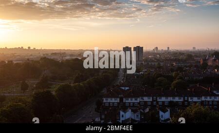 Sunset over terraced houses and the Lambeth Cemetery at Blackshaw Road in Tooting, south west London. Stock Photo