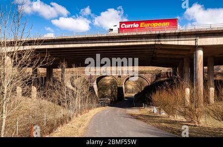 Tebay, England, UK - March 30, 2013: Viaducts carry the M6 motorway and West Coast Mainline railway over the Borrow Beck in the Lune Gorge in Cumbria. Stock Photo