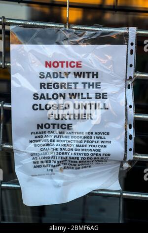 Coronavirus Closure Sign, Hair Salon Window Stock Photo