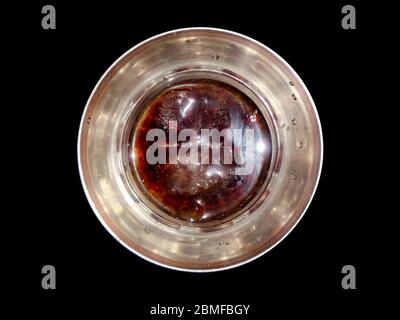 Top angle view of scotch whiskey in the glass isolated on black background Stock Photo