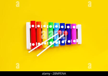 Colorful xylophone on yellow background. Stock Photo