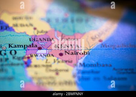 Shallow depth of field focus on geographical map location of country Kenya in Africa continent on atlas Stock Photo