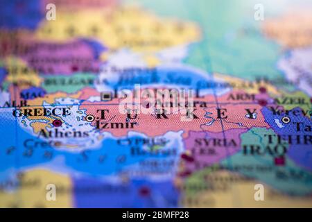 Shallow depth of field focus on geographical map location of country Turkey in Asia continent on atlas Stock Photo