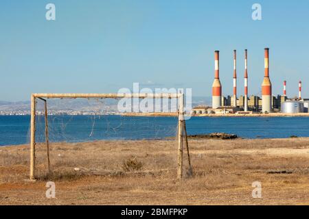 Old goal posts with Dhekelia Power Station in the background, Dhekelia Bay, Cyprus Stock Photo