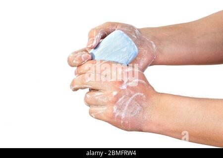 Young man wash hands with soap, closeup detail on soap bubbles, isolated on white. Can be used during coronavirus covid-19 outbreak prevention Stock Photo