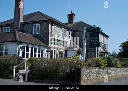 The Rising Sun, Clanfield, Hampshire, UK.  Local popular public house and accommodation closed due to Coronavirus. Stock Photo