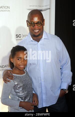 ***FILE PHOTO*** Music Executive, Andre Harrell, Has Passed Away at 59. 29 September 2011-New York, NY - Andre Harrell and Guest at the Shawn Carter Foundation hosting of the 2011 Carnival ' Making the Ordinary Extraordinary: The Shawn Carter's Foundation's exclusive fundraising event to support its college scholarship on September 29, 2011 held at Hudson River Park's Pier 54 in New York City. Credit: Mpi43/Media Punch Stock Photo