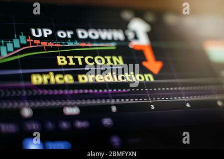 Cryptocurrency price prediction movement of Bitcoing on screen. Btc graph chart analysis trading stock. Stock Photo