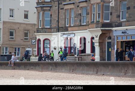 Portobello Beach Edinburgh, Scotland, UK, 9th May 2020. Early Police appearance of four officers both male and female at the reasonably quiet seaside today perhaps in expectation of the warmer weather bringing more visitors to take their permitted excercise. Stock Photo