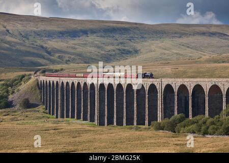 Steam locomotive 61994 The Great Marquess crossing Ribblehead viaduct on the settle to Carlisle line with the West coast railways fellsman train Stock Photo