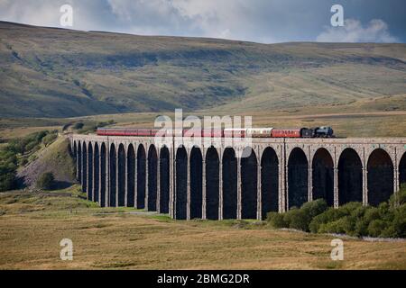 Steam locomotive 61994 The Great Marquess crossing Ribblehead viaduct on the settle to Carlisle line with the West coast railways fellsman train Stock Photo