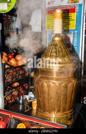 Turkey, Istanbul, 20.12.2019: Sahlep drink with cinnamon and ground pistachios. Sahlep is a deliciously comforting hot milky drink, very popular in Tu Stock Photo