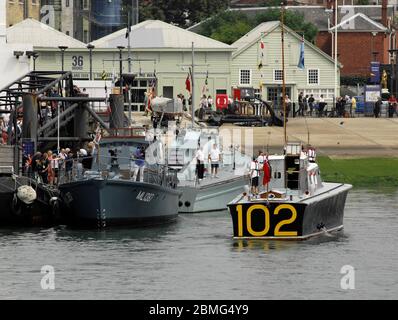 AJAXNETPHOTO. 25TH AUGUST, 2016. PORTSMOUTH, ENGLAND. - COASTAL FORCES 100TH ANNIVERSARY - RESTORED SECOND WORLD WAR COASTAL FORCES 'LITTLE SHIPS' FLOTILLA INCLUDING HARBOUR DEFENCE MOTOR LAUNCH MEDUSA, MGB 81, HSL 102 MOORING UP AT THE PNBPT BERTH OPPOSITE HMS WARRIOR.  PHOTO:JONATHAN EASTLAND/AJAX REF:D162508 6194 Stock Photo