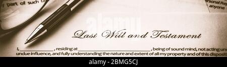 Last Will And Testament Document With Pen And Reading Glasses - Death And Inheritance Concept Stock Photo