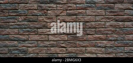 Brown brick wall. Hand made brick wall. Stock Photo