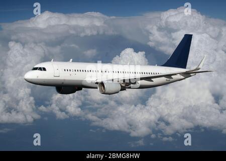 Airbus A320 aircraft airliner passenger jet plane airplane flying in flight airborne above cloud cloudy sky air travel commercial aviation high up Stock Photo