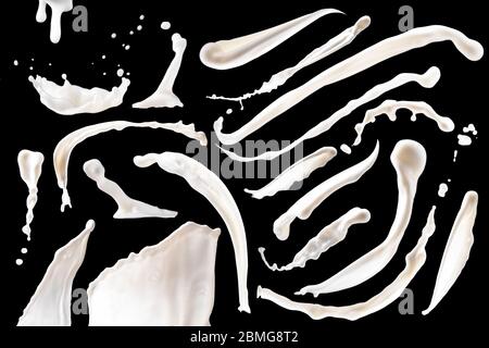 group of milk or white liquid splashes isolated on black background Stock Photo