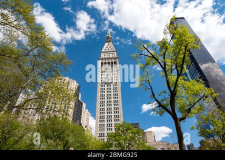 MetLife Tower with spring trees of Madison Square Park in the foreground, NYC, USA Stock Photo