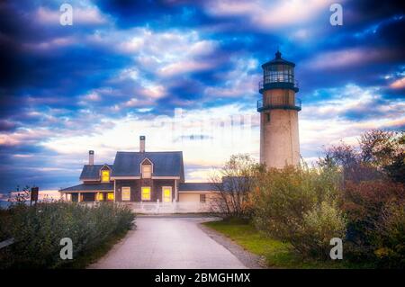 The highland lighthouse in north truro massachusetts on cape cod against a dramatic sunset sky built in 1857. Stock Photo