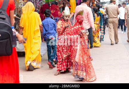Indian Woman and man dressed as hindu gods at Pushkar camel fair Stock Photo