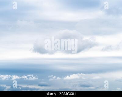 natural background - white clouds in gray sky on spring cloudy day Stock Photo