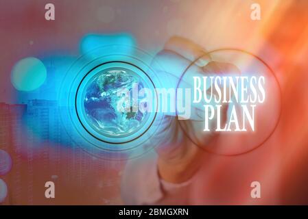 Writing note showing Business Plan. Business concept for Structural Strategy Goals and Objectives Financial Projections Elements of this image furnish Stock Photo