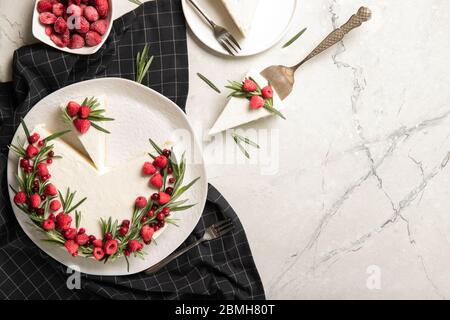Plate with delicious raspberry cheesecake. On a wooden background Stock Photo