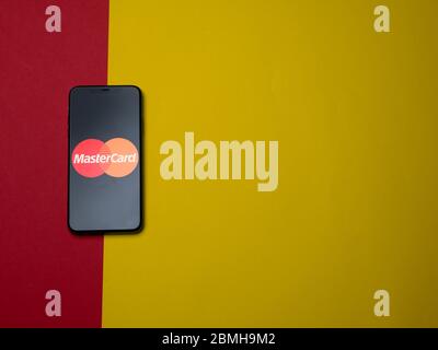 USA - May, 2020 MasterCard App on Iphone Screen on colored paper background. Mastercard is a multinational financial services corporation. Stock Photo