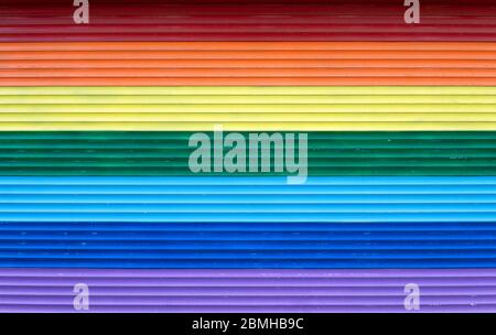 Abstract rainbow colored horizontal stripes background resembling plasticine blocks. Stock Photo