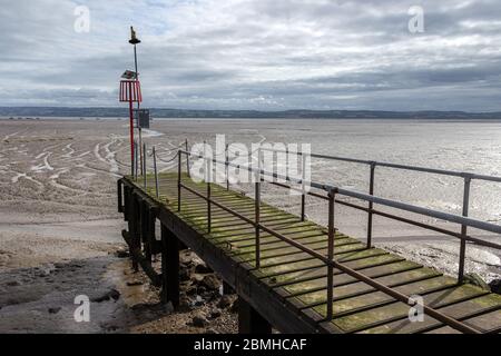 Wooden Jetty, West Kirby. At high tide on the Dee estuary it provides access from the Marine Lake to moored yachts. Stock Photo